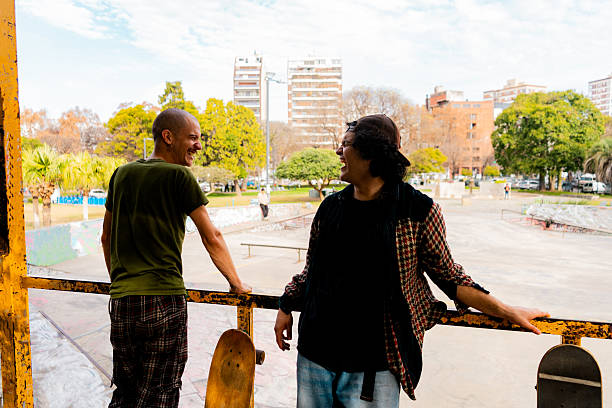 Skater friends talking on the public park