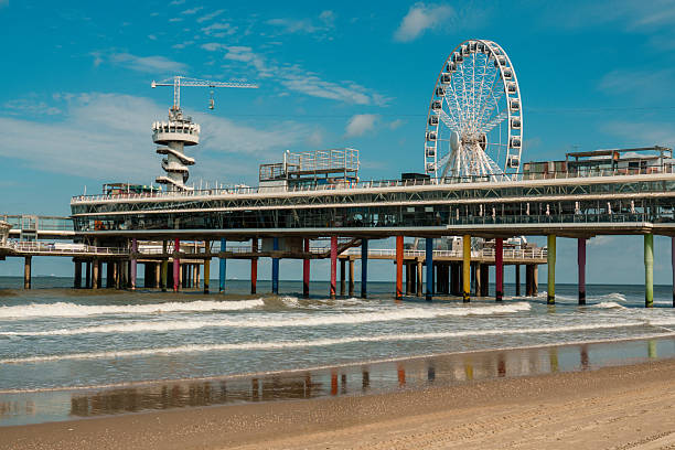istock Pier Ferris Wheel Beach Colorful Columns Waves 2235582517