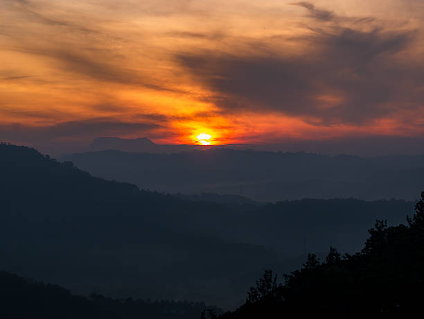 istock Sun behind the clouds above the mountains 2235584204