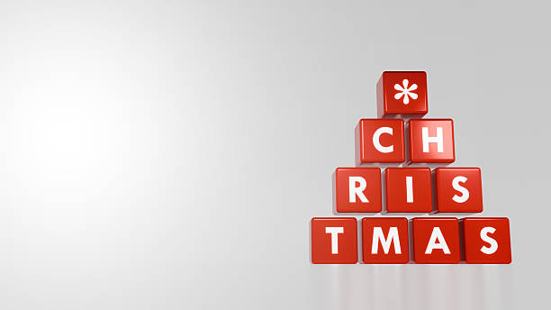istock Stacked Red Christmas Cubes With Bold White Letters Arranged Pyramid Shape Against White Background For Festive Winter Design 2235587477