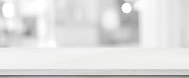 istock Empty white table top, counter, desk background over blur abstract bokeh light background, White marble stone table, shelf and blurred white backgroundt for food, product display mockup, template 2235587785