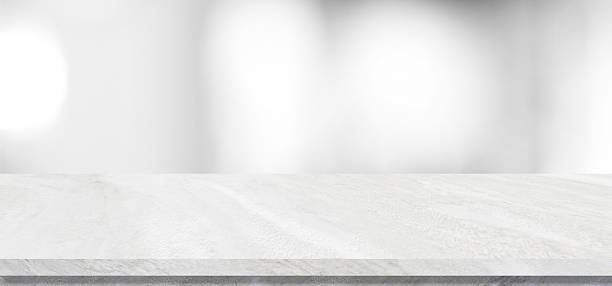 istock Empty white table top, counter, desk background over blur abstract bokeh light background, White marble stone table, shelf and blurred white backgroundt for food, product display mockup, template 2235587965