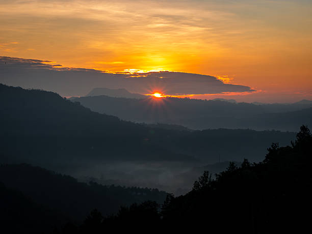 istock Sun behind the clouds above the mountains 2235588395