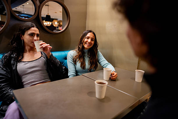 Friends drinking and talking on a restaurant