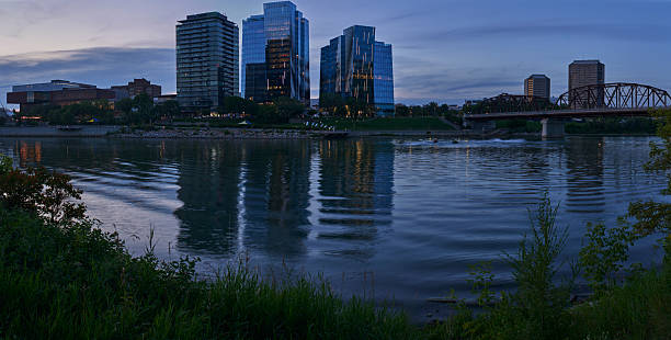 istock City skyline at twilight with park foreground in Saskatoon 2235592544