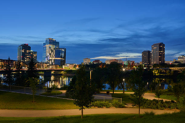 istock City skyline and riverside park at dusk in Saskatoon 2235592613