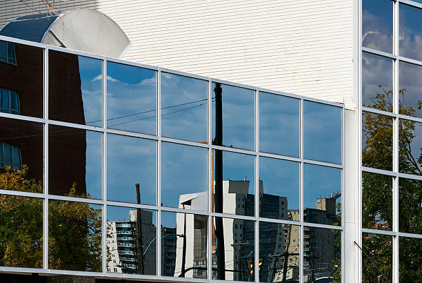 Ottawa, Canada - October 17, 2024: Bank of Canada building with Canadian flag in Ottawa downtown.