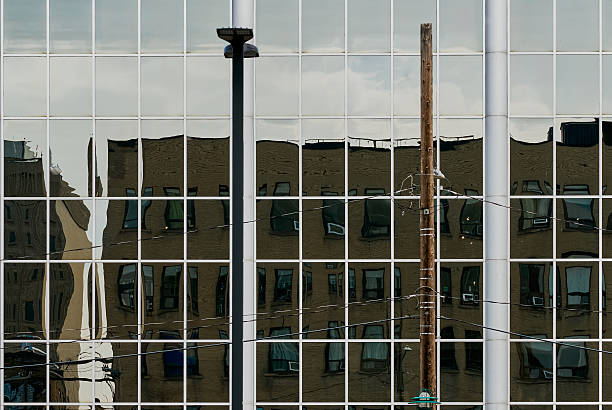 istock Glass facade reflecting moody sky in Saskatoon downtown 2235593642