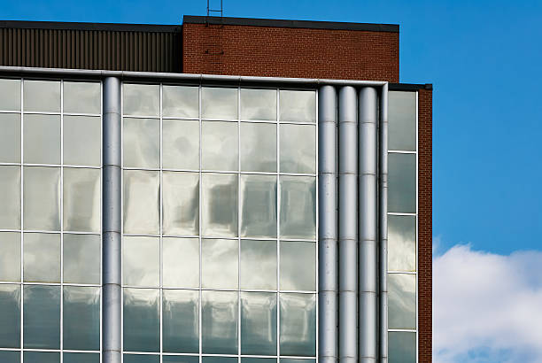 istock Glass facade reflecting moody sky in Saskatoon downtown 2235593644