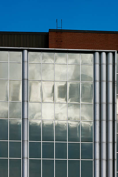 istock Glass facade reflecting moody sky in Saskatoon downtown 2235593649