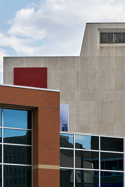 Brick office building with glass reflection and signage