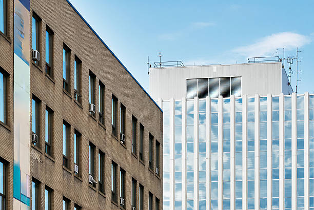 istock Modern office tower with vertical windows in urban scene 2235593686