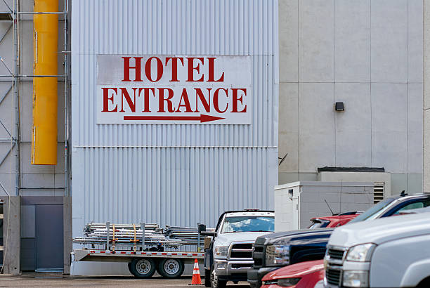 Blank hotel entrance sign on industrial wall