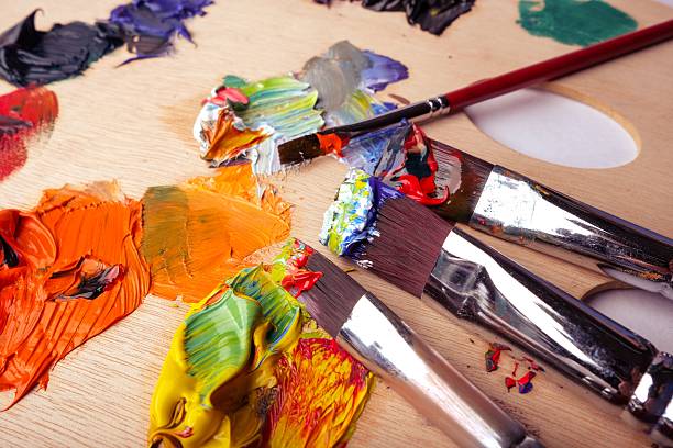 istock Colorful oil paints and brushes on palette. 2235594616