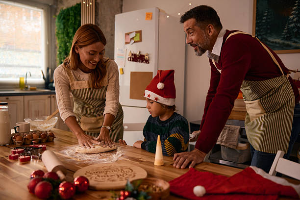 istock Family making Christmas cookies in the kitchen 2235594975