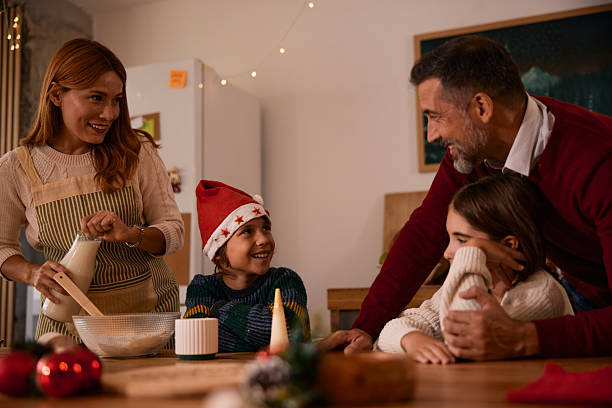 istock Family preparing Christmas sweets in the kitchen 2235597068