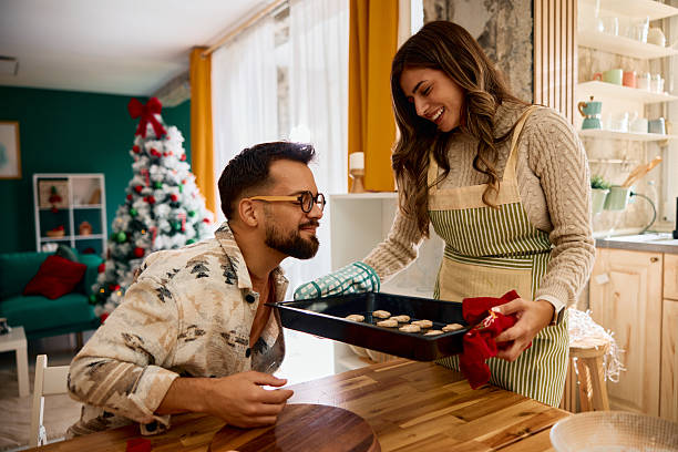 istock Couple baking Christmas cookies at home 2235597894