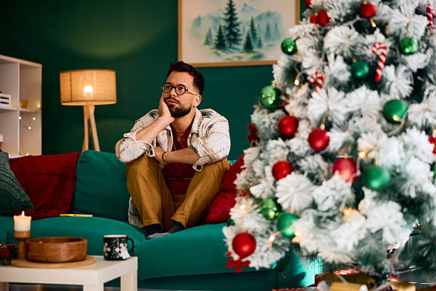 istock Lonely man feeling melancholic during christmas holidays 2235599493