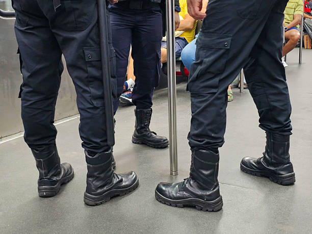 Police officers wearing black uniforms
