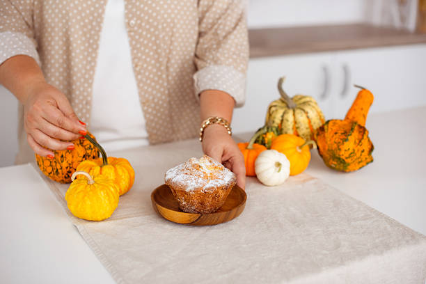 Pumpkin cake on kitchen table for Thanksgiving and Fall season concept