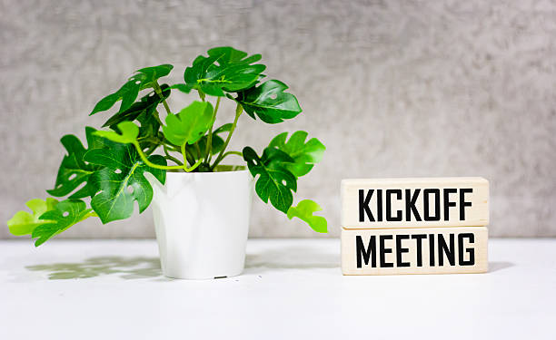 istock A desk with wooden blocks. text Kickoff meeting 2235605516