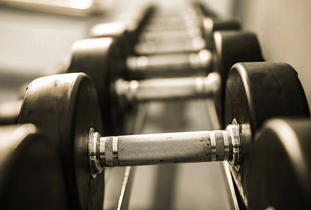 istock Rack With Row Of Dumbbells For Workouts 2235607457