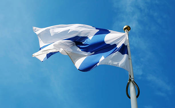 istock National Finland Flag Waving Against Sky Background 2235608588