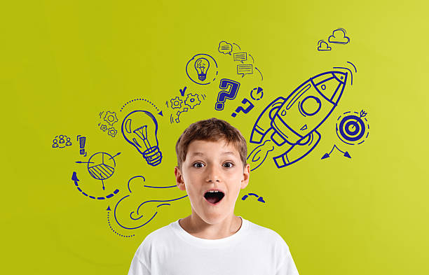 istock Surprised boy in white shirt with creative doodles of rocket and 2235614831