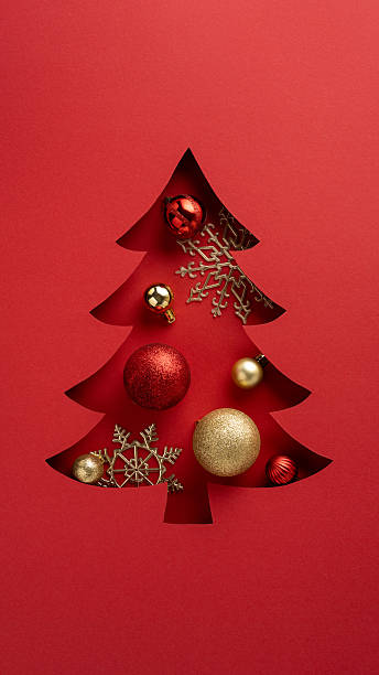istock Beautiful vertical festive card featuring a Christmas tree cutout filled with baubles and ornaments 2235616916