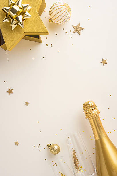 istock Golden vertical decorations including champagne bottle and confetti create a festive New Year celebration atmosphere 2235616992