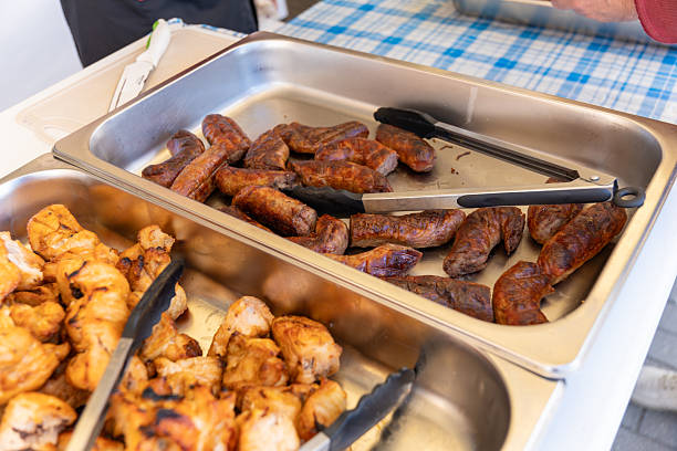 istock Grilled sausages and kebabs on serving trays at a Swedish table buffet. 2235618140