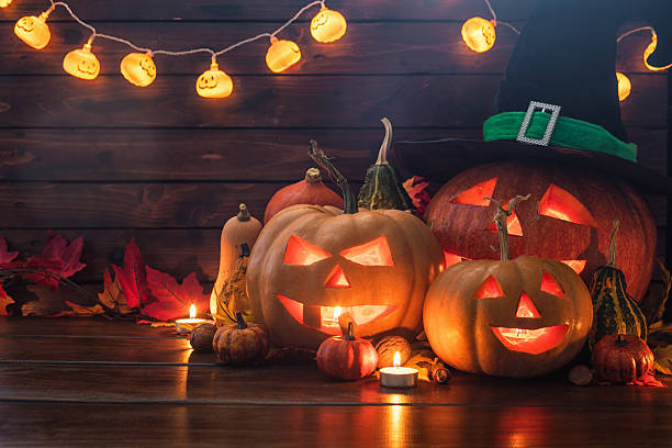 istock Jack O’ Lanterns on The Old Wooden Background 2235619302