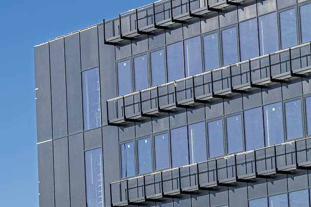 istock Partial view of a building under construction with a metal and glass facade 2235622859