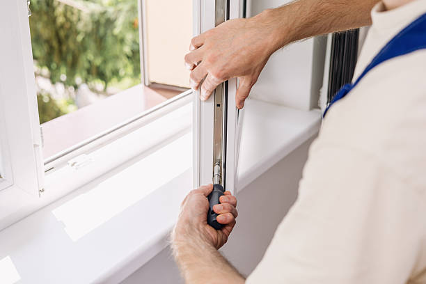 istock Repairman installing a PVC window frame for better home comfort 2235623054
