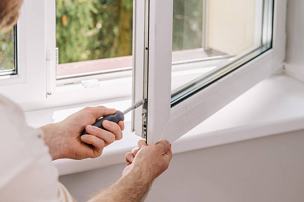 istock A repairman is installing a PVC window frame in a residential apartment 2235623064
