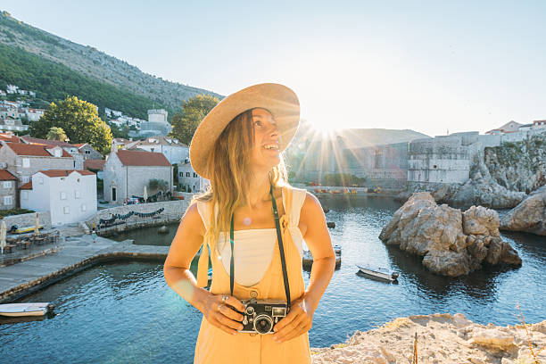 istock Photographer Enjoying Sunny Coastal View 2235624644