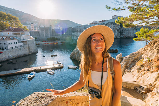 istock Smiling Tourist Enjoying Coastal View 2235625481