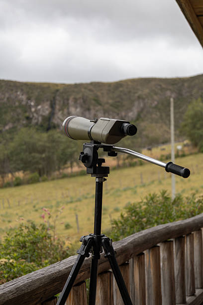istock Telescope on wooden terrace with mountain view 2235627778