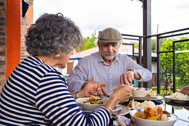istock Grandparents enjoying lunch on the terrace 2235631357