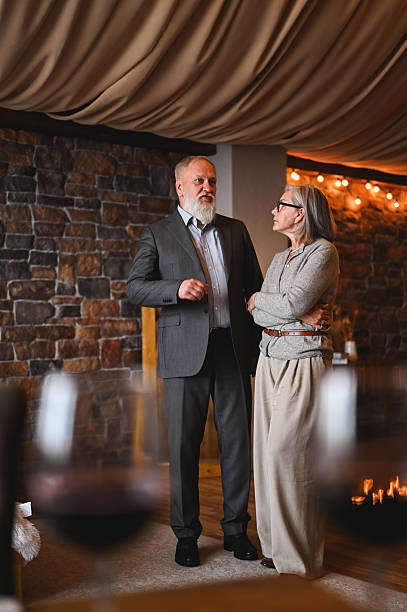 istock Senior couple chatting in a restaurant before a romantic dinner 2235632694