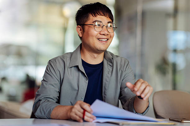 istock Happy Professional Engaged in Office Work in a Modern Workspace 2235638886