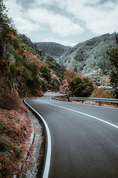 istock Winding autumn mountain road 2235643343