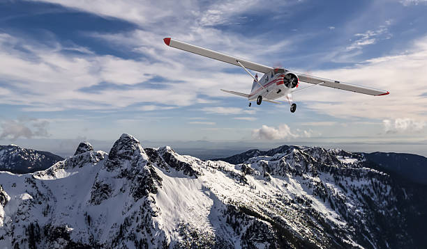 Small airplane flying above snowy mountains during a clear winter day, 3D rendering.