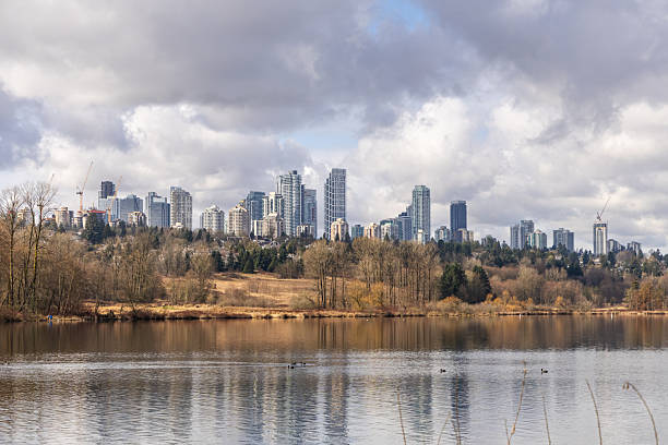 istock Urban Skyline Overlooking Tranquil Deer Lake in Burnaby, British Columbia 2235644130