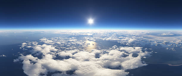 istock 3D Rendering of Sunlit Clouds Over Landscapes from High Altitude 2235644230