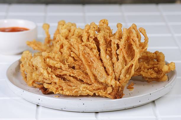 istock Crispy Golden Enoki Mushroom Snack Close-Up 2235645996