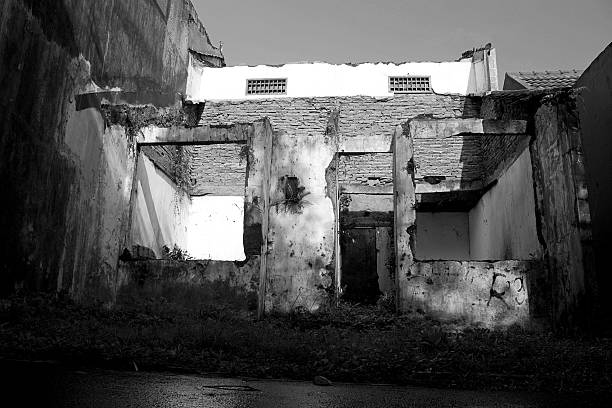istock Abandoned Old Building with Damaged Walls in Black and White 2235646671