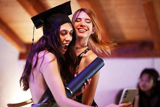 istock Two friends celebrating a graduation moment with joy and laughter 2235647849