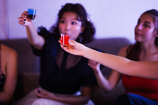istock Women Sharing a Fun Moment Toasting Drinks Together During a Celebration 2235647850