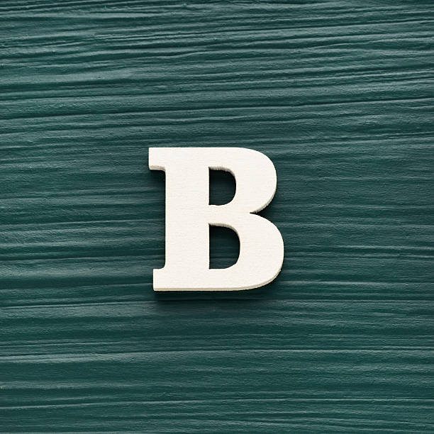 istock Capital letter B, White letter on a rustic dark green background 2235649403